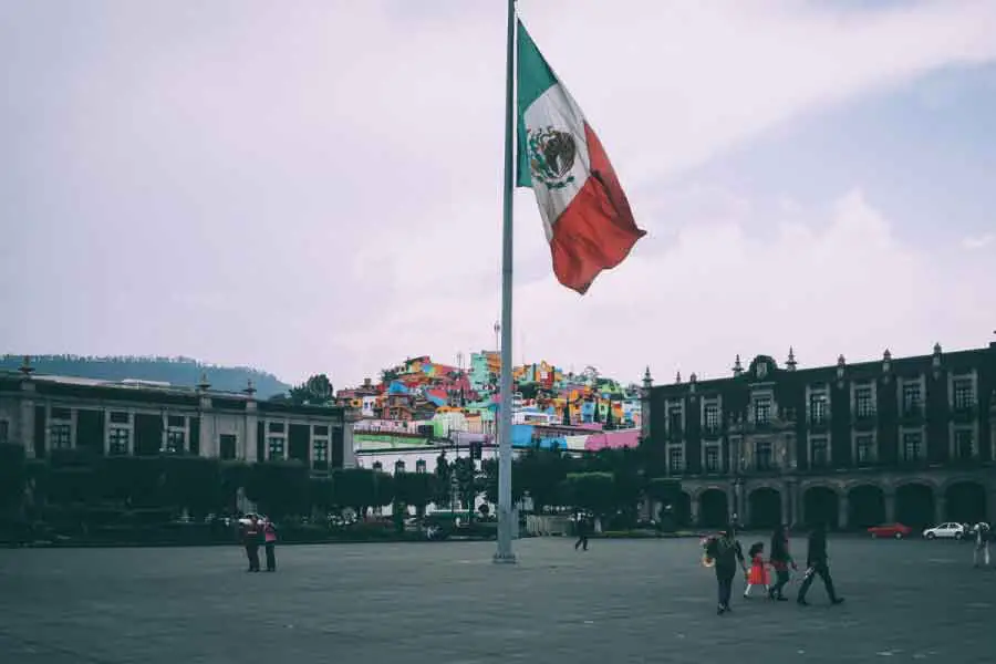 people around a mexican flag